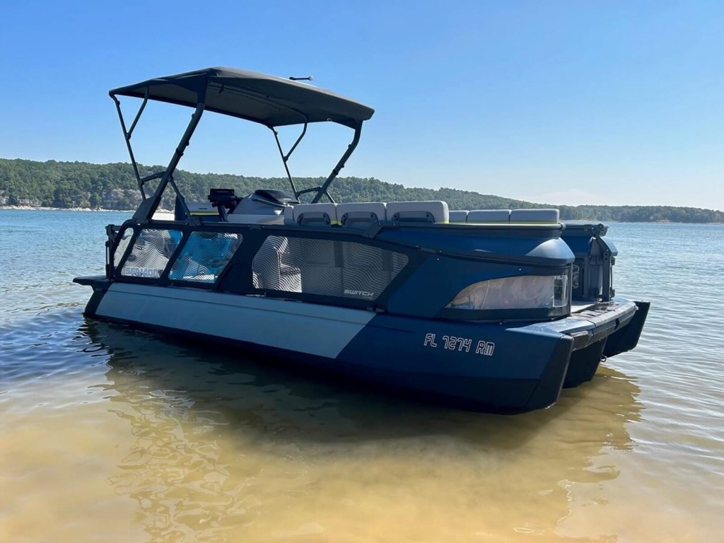 A Sea-Doo pontoon boat, a Switch, shows off its profile.