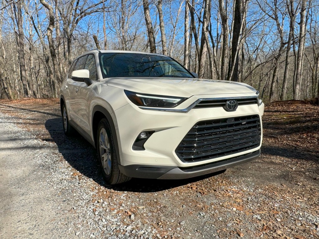 The 2024 Toyota Grand Highlander Hybrid in dirt and gravel