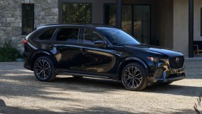 The 2025 Mazda CX-70 parked near a house