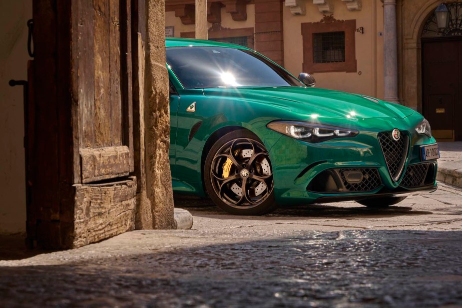 The front end of an Alfa Romeo Giulia Quadrifoglio parked in an alley