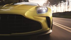 A new Aston Martin Vantage shows off its big grille and new lights.