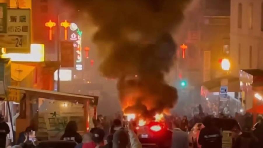 Waymo robotaxi set on fire by a mob in the San Francisco Chinatown