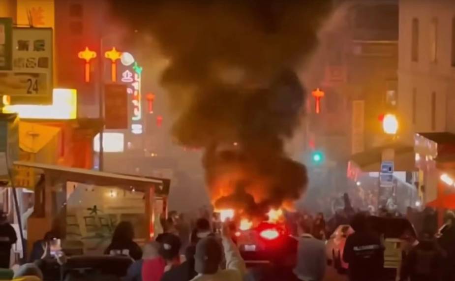 Waymo robotaxi set on fire by a mob in the San Francisco Chinatown