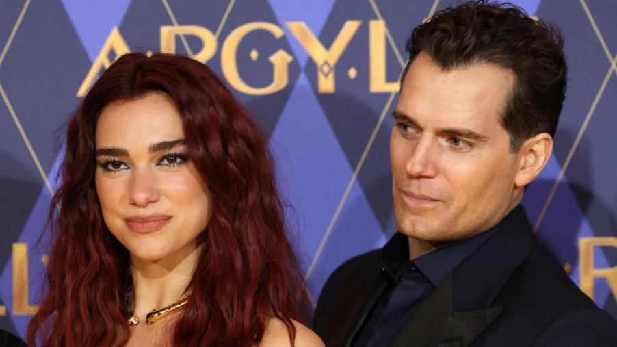 Dua Lipa and Henry Cavill take pictures at the premier of Argylle.