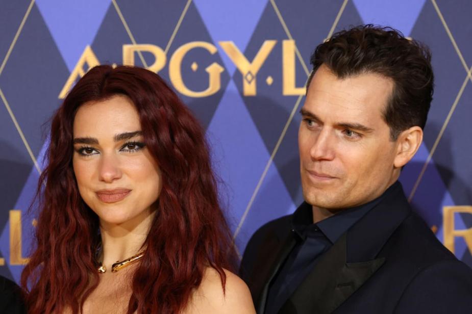 Dua Lipa and Henry Cavill take pictures at the premier of Argylle.
