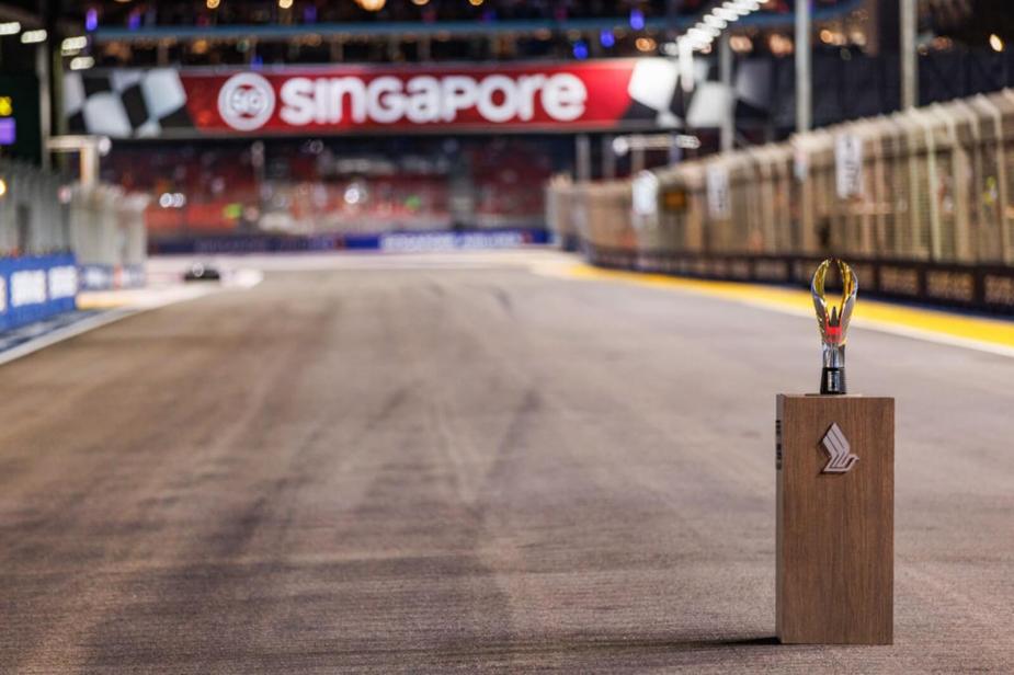 An F1 trophy sits on the track of a racing track in Singapore.