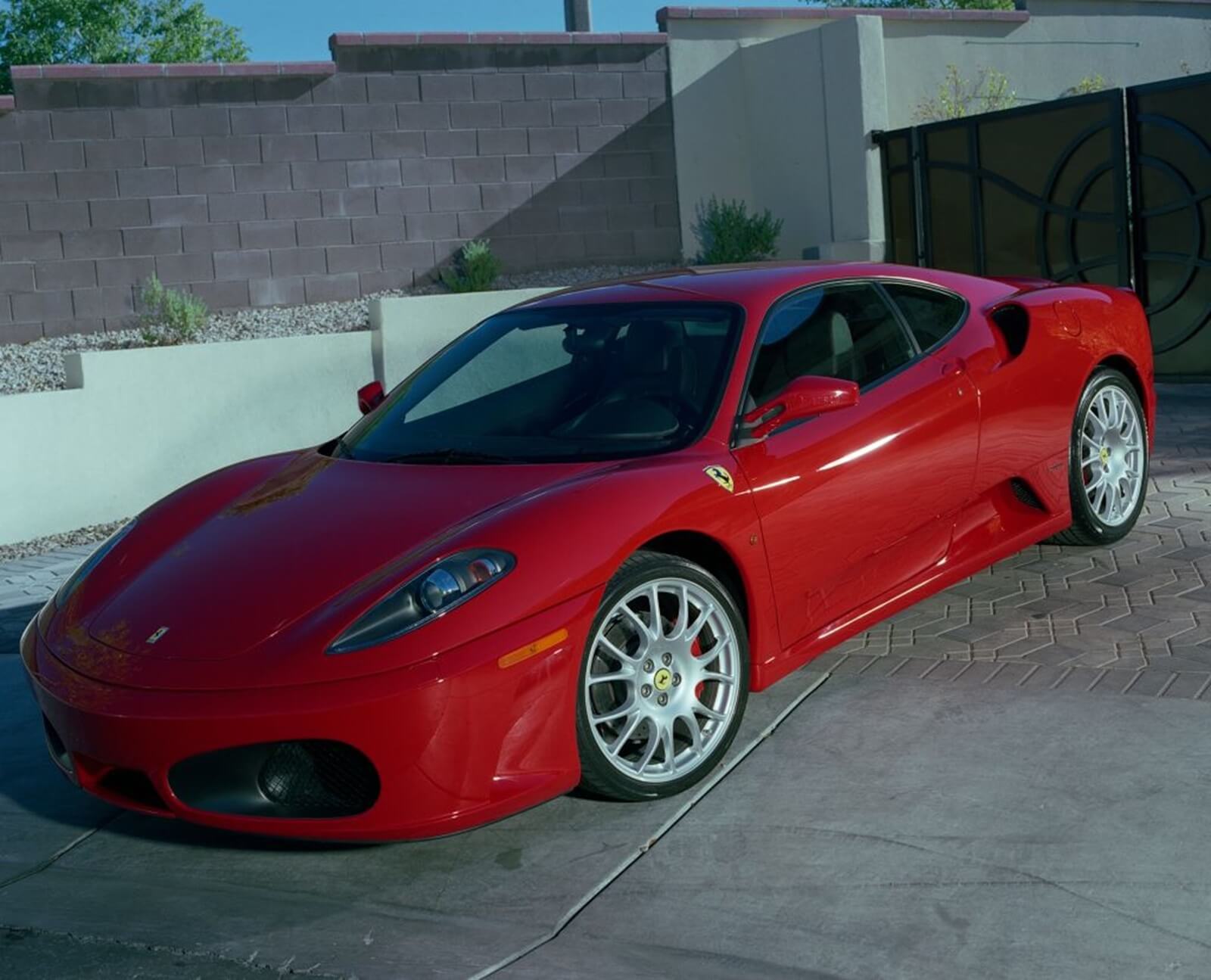 Floyd Mayweather Jr's Ferrari 430 in front of a garage.