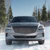 Front View 2024 Genesis GV80 midsize luxury SUV on a snow-covered road.