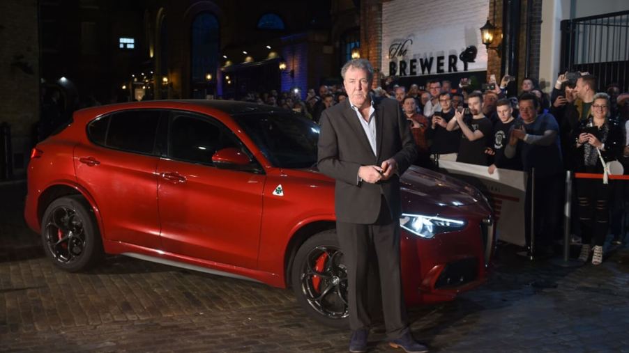 Jeremy Clarkson at an event with an Alfa Romeo Stelvio Quadrifoglio.