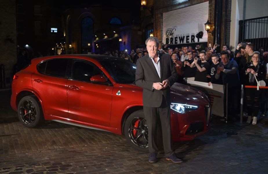 Jeremy Clarkson at an event with an Alfa Romeo Stelvio Quadrifoglio.