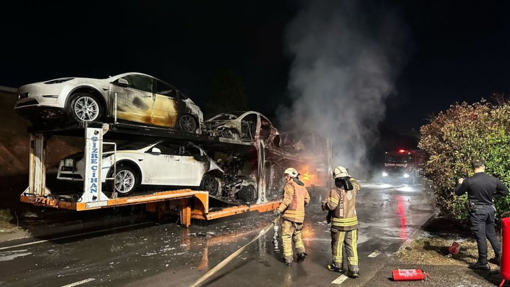 Firefighters put out electric car fires after Teslas burned on a railway.