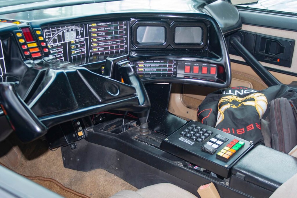 A replica KITT from Knight Rider resembling the one David Hasselhoff drove in the show shows off its interior. 
