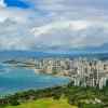 The skyline of Honolulu Hawaii, the Pacific Ocean visible in the background.