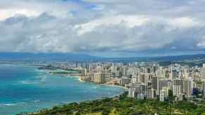 The skyline of Honolulu Hawaii, the Pacific Ocean visible in the background.