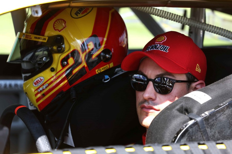Joey Logano sits in his No. 22 Team Penske Ford ahead of the 2023 Hollywood Casino 400 at Kansas