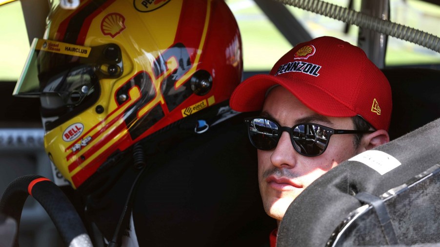 Joey Logano sits in his No. 22 Team Penske Ford ahead of the 2023 Hollywood Casino 400 at Kansas