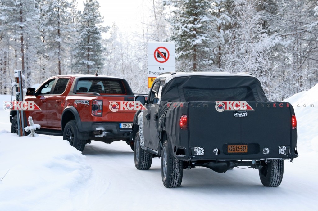 The Ford Ranger and Kia Tasman in the snow
