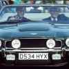 King Charles driving his gifted green Aston Martin V8 convertible with his body guard in 1988