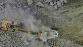Excavator digs lithium at a mine in brazil.
