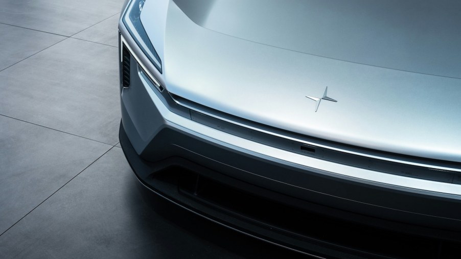 The logo of the Polestar EV startup on the hood of an electric car.