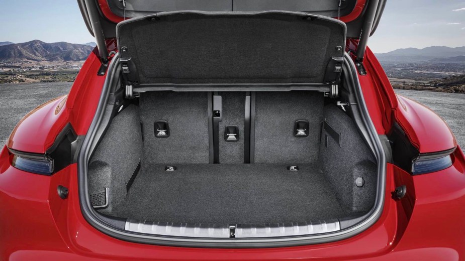 Storage space in the trunk of a red Porsche station wagon EV.