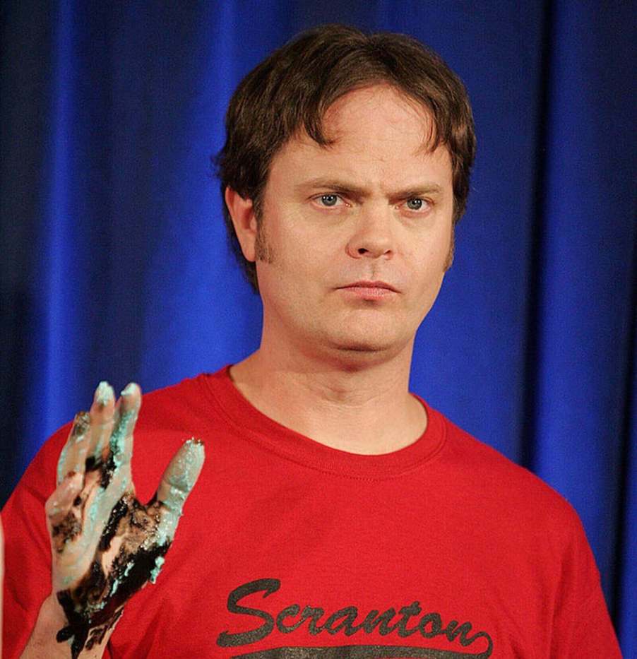 Rainn Wilson, the actor behind Dwight Schrute from The Office, poses in a Scranton Dunder Mifflin shirt