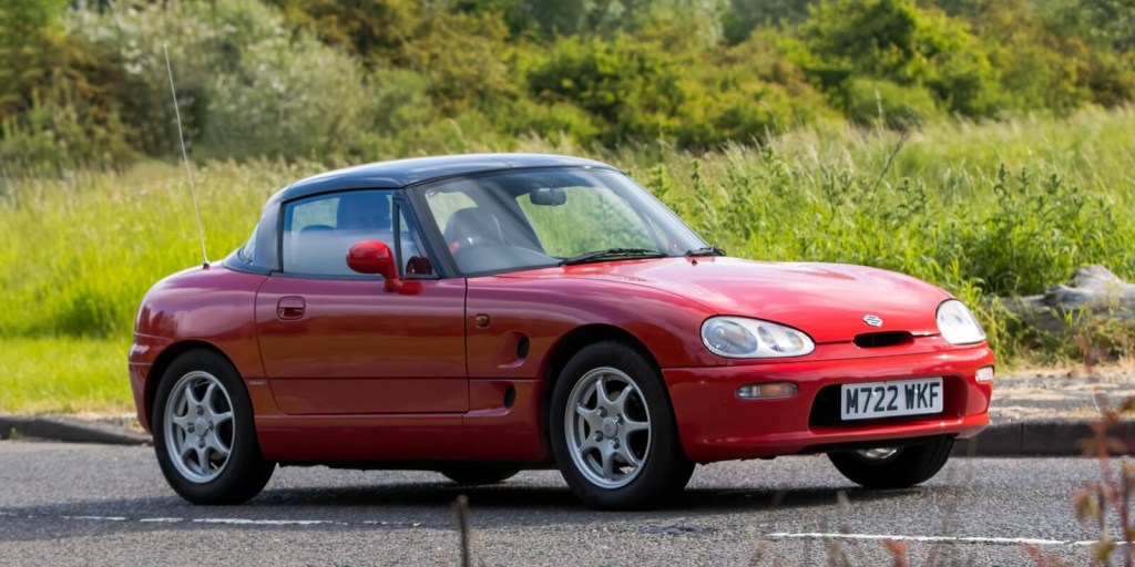 A red Suzuki Cappuccino, like the model that Generation Z loves, takes a corner