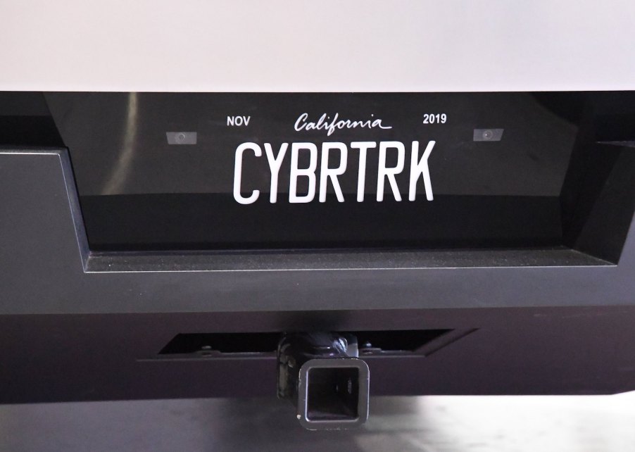 The "Bybrtrk" vanity plate on a Tesla Cybertruck parked in a museum