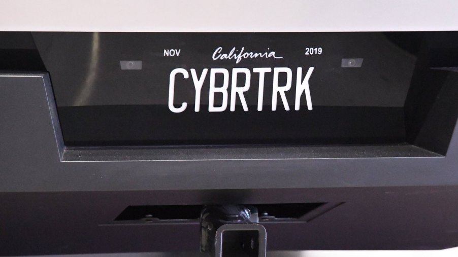 The "Bybrtrk" vanity plate on a Tesla Cybertruck parked in a museum