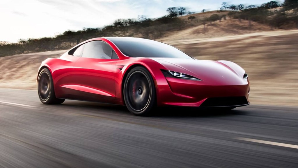 A Tesla Roadster, which will be one of the fastest cars from 0 to 60, cruises a highway. 