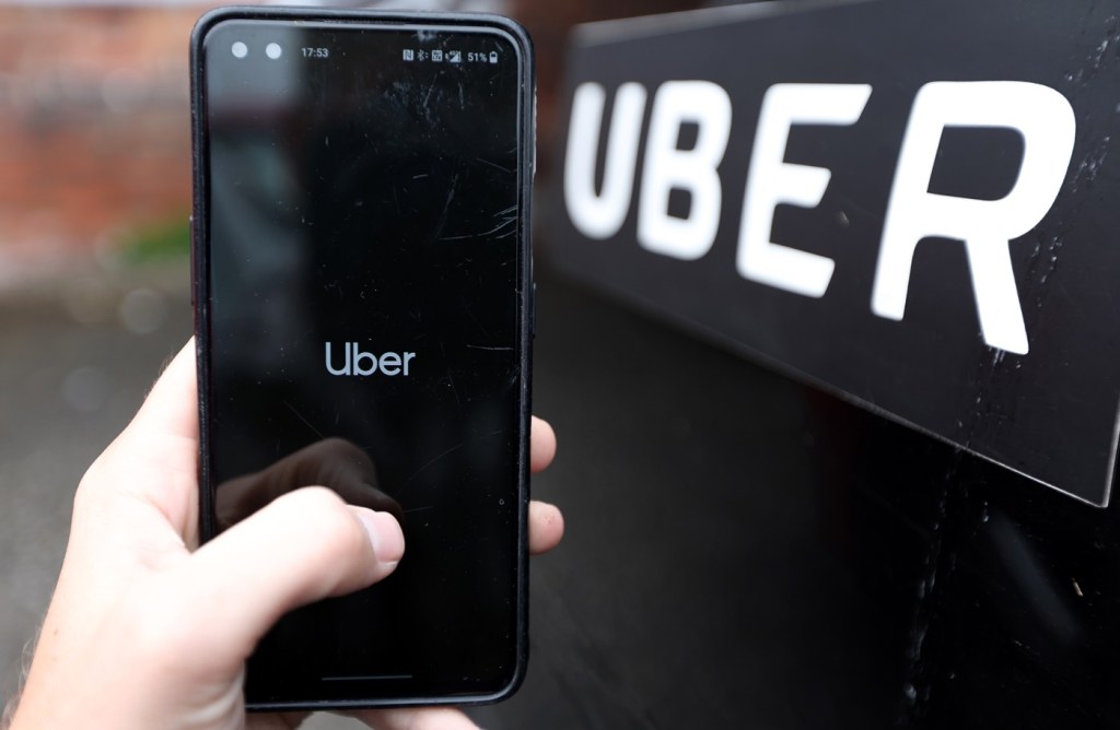 A phone with the Uber app on it