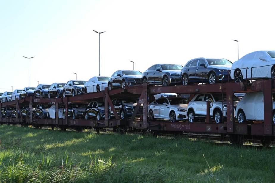 Volkswagen cars, along with Audis are stacked on a train after clearing conditions that could've got them impounded.