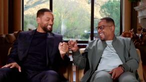 Will Smith and Martin Lawrence, stars of Bad Boys II, bump knuckles.