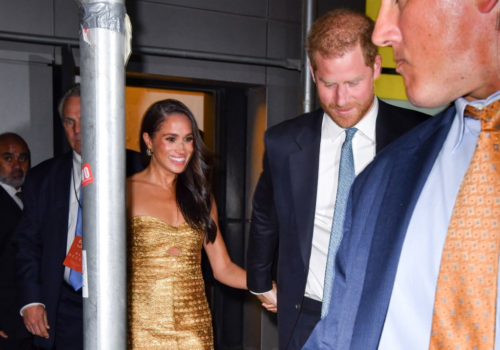 Paparazzi follow Meghan Markle and Prince Harry as they exit an event in NYC in May 2023