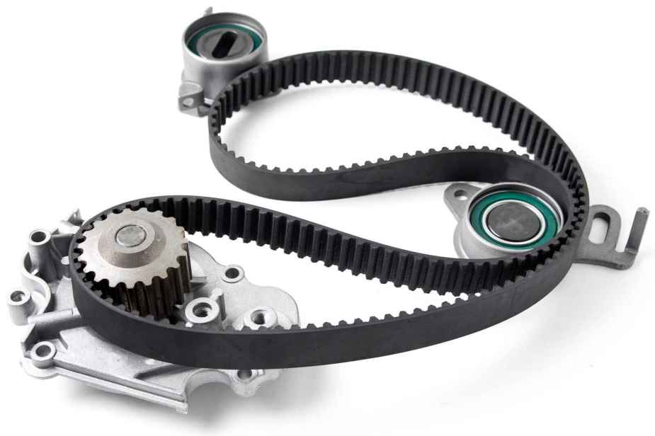 Car engine timing belt kit components are laid out on a white surface