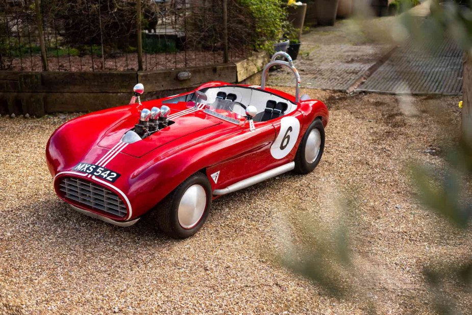 Red vintage roadster body on a Crosley car.