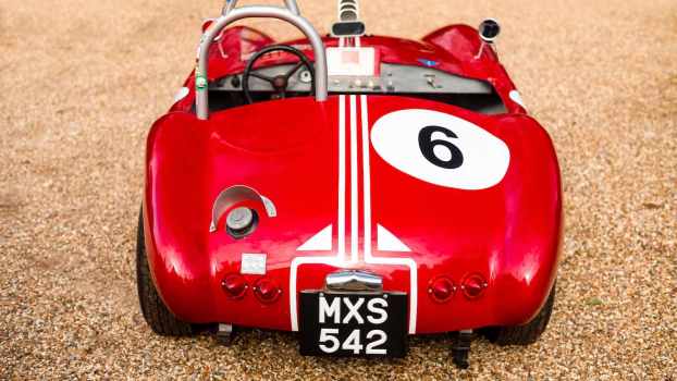 Rear of a red vintage roadster race car.