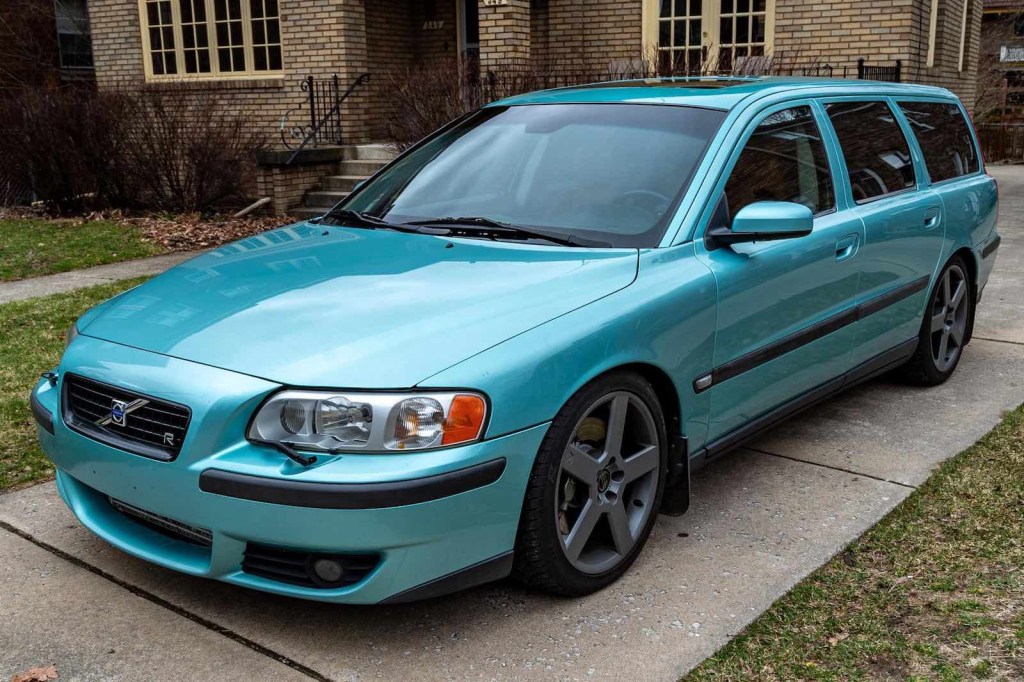 Teal colored turbocharged Volvo special edition station wagon parked in a driveay.