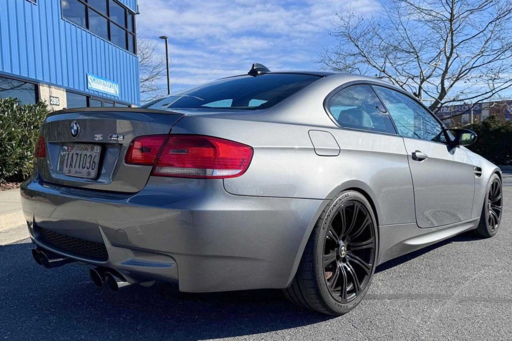 Rear tires of a 2008 BMW M3 coupe powered by a V8 engine.