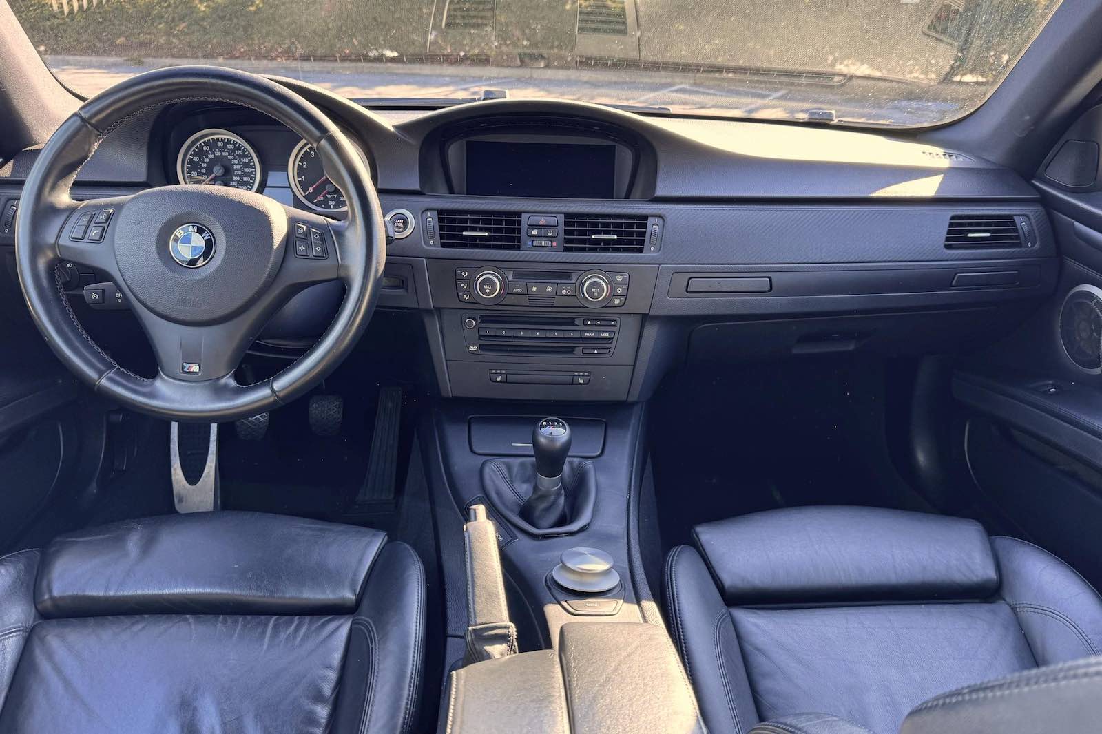 Leather interior of a stick shift 2008 BMW M3 coupe with a V8 engine.