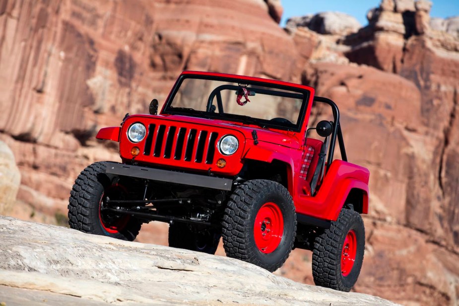Grille of a red Jeep concpet vehicle off-road in the desert.