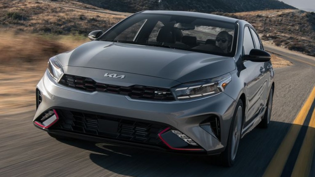 2022 Kia Forte driving on a road. 