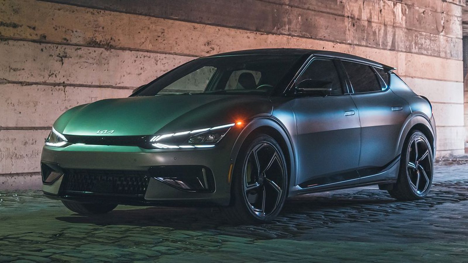2023 Kia EV6 electric SUV posed in a dark setting.