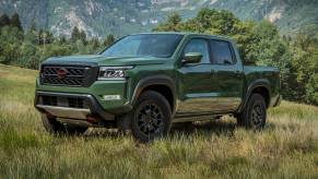 The 2023 Nissan Frontier off-roading in a field