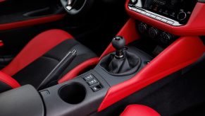 A 2023 Nissan Z sports car shows off its manual transmission shift knob.