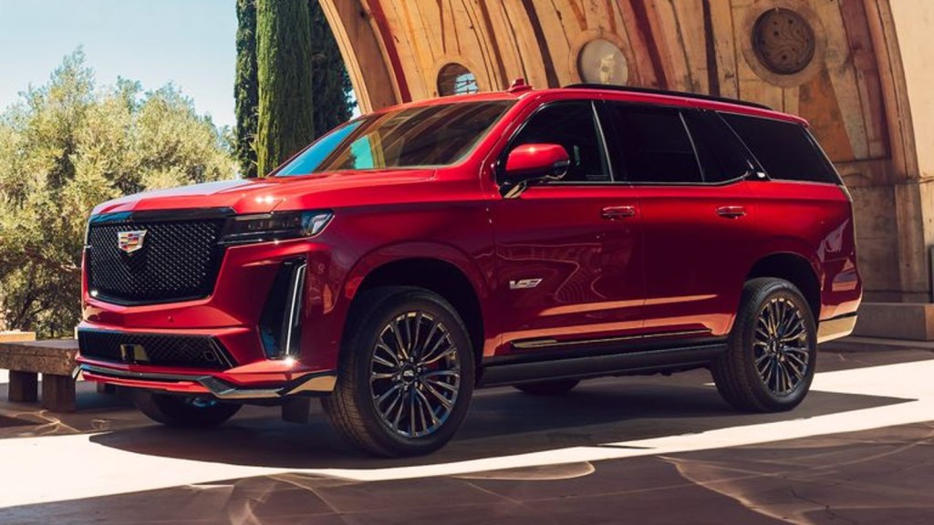 Red 2024 Cadillac Escalade V-Series full-size luxury SUV posed.
