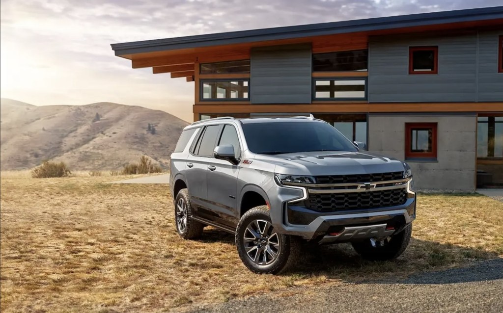 The 2024 Chevy Tahoe parked near a home