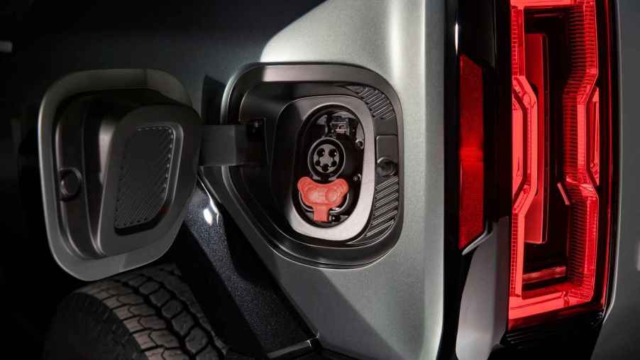 A GMC Hummer EV SUV charge port shown in close view