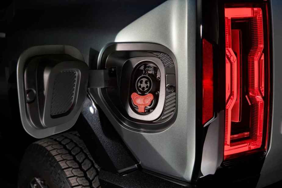 A GMC Hummer EV SUV charge port shown in close view
