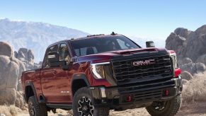 The 2024 GMC Sierra 2500 HD AT4X crawling over rocks
